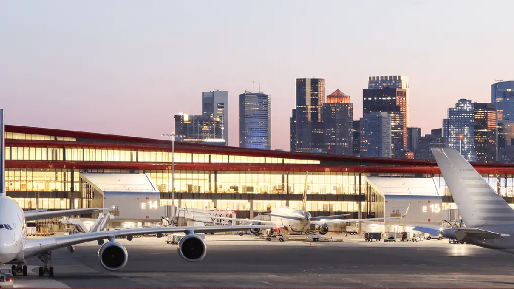 Luxury black car service pickup at Boston Logan International Airport terminal
